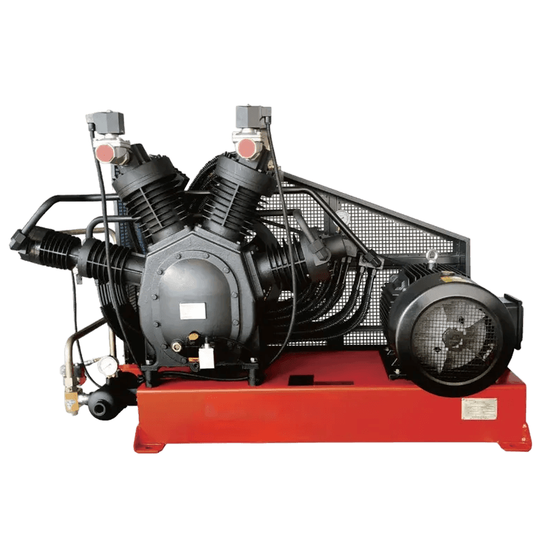 Industrial air compressor with red base, black motor, and fan.